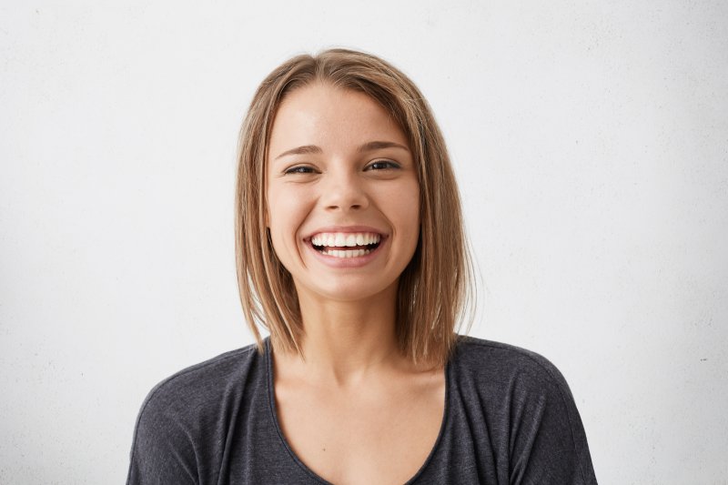 two people with cosmetic dentistry smiling